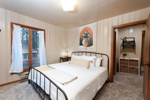 a bedroom with a large bed and a window at 151 CR 200 1 Bedroom Cabin in Durango