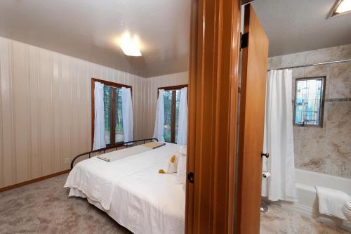 a bedroom with a bed and a window at 151 CR 200 1 Bedroom Cabin in Durango