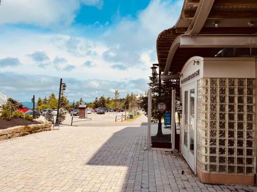 a sidewalk in front of a building on a street at Ski In/Out (In The Village Close To Everything) in Snowshoe