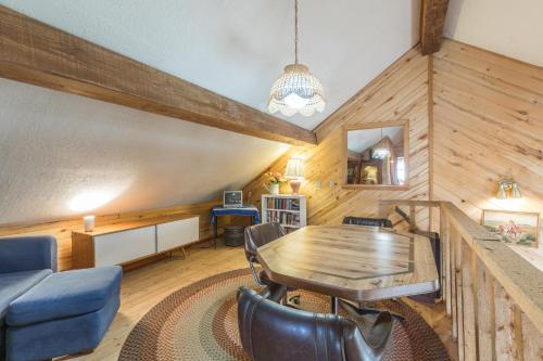 a dining room with a wooden table and chairs at Charming Starlight Cabin in Creede