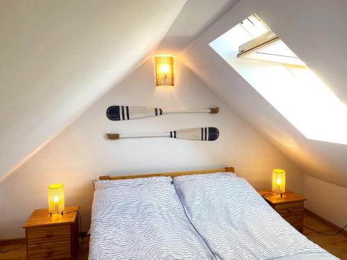 a bedroom with a bed with skis on the wall at Apartament Kalimera in Żarnowska