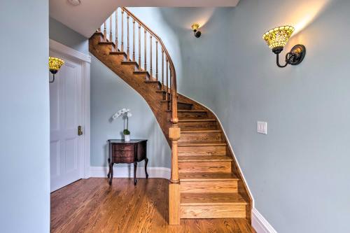 a staircase in a home with blue walls and wooden floors at Charming Greenport Gem 1, 1 Mile to Ferry! in Greenport