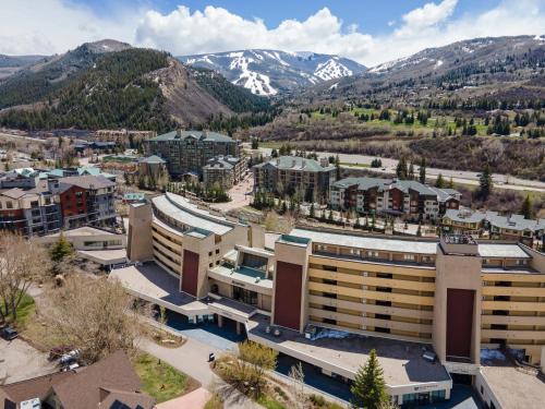 an aerial view of a city with mountains at The Seasons Unit 205 in Avon