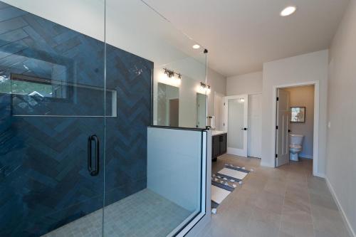 a bathroom with a shower with a glass door at 275 Estancia Loop in Hermosa