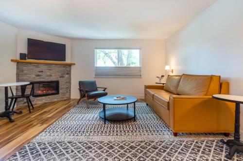 a living room with a couch and a fireplace at The Inn on Pine in Calistoga