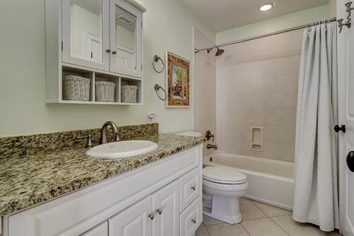 a bathroom with a sink and a toilet and a tub at 53 Fazio in Hilton Head Island