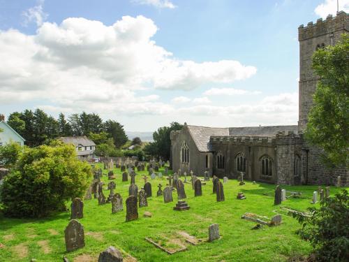 a group of graves in front of a church at The Old Forge in Newton Abbot