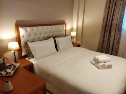 Posteľ alebo postele v izbe v ubytovaní Cozy Apartment in the Heart of Thessaloniki