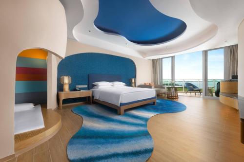 Postel nebo postele na pokoji v ubytování Hyatt Regency Hainan Ocean Paradise Resort