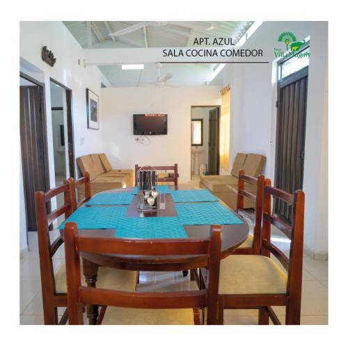 a dining room with a table and chairs at FINCA VILLA MAGALY en medio de la Naturaleza in Melgar