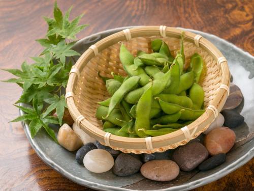 a basket full of vegetables on a plate at Takanosukan in Sekikawa