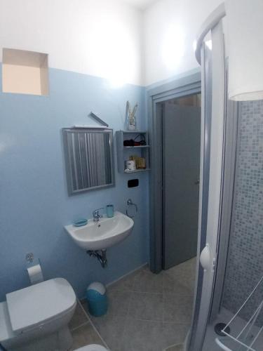 a bathroom with a sink and a toilet and a shower at Ely Sea in Belvedere Marittimo