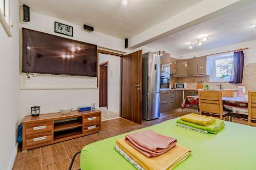 a kitchen with a table with towels on it at Apartments Mir - perfect location & cosy in Korčula