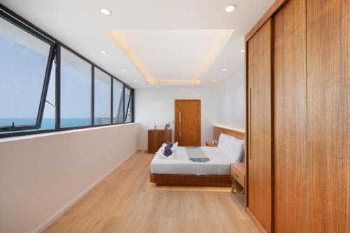 Ένα ή περισσότερα κρεβάτια σε δωμάτιο στο Villa The Wave 2 Residence