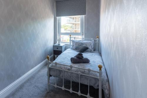 a bedroom with a bed with a teddy bear on it at The Old Nags Head in Bishop Auckland