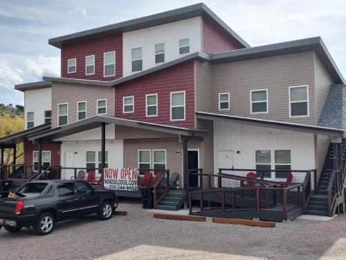a house with a car parked in front of it at Winzig Lodge in Lava Hot Springs