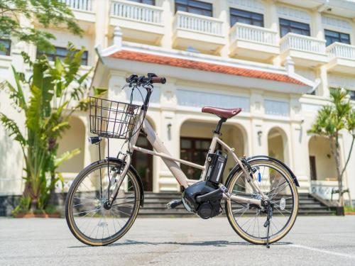 a bike parked in front of a building at Ada Garden Hotel Okinawa in Kunigami