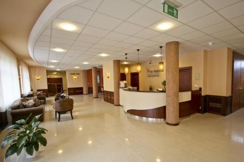 a lobby of a hospital with a waiting room at Vis Vitalis Hotel in Kerepes