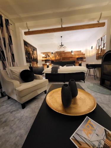 a large living room with a bed and a table at Apartment Villa Hřensko 132 in Hřensko