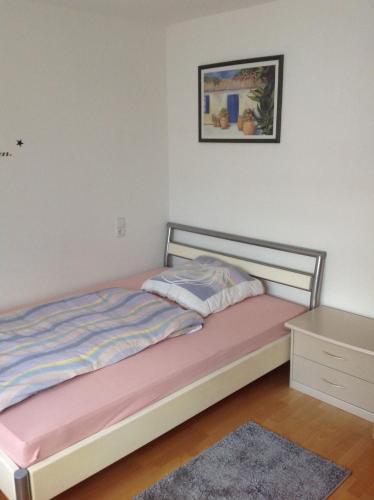 a bedroom with a bed with a pink mattress at Ruhige Wohnung in Schnaitheim bei Heidenheim in Heidenheim