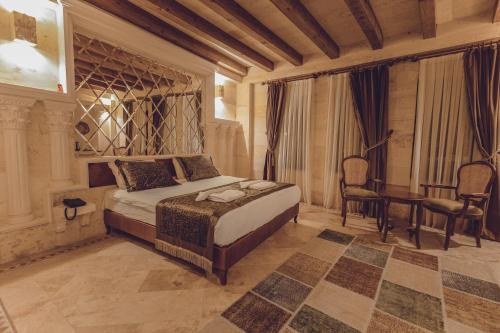 Ένα ή περισσότερα κρεβάτια σε δωμάτιο στο Sobek Stone House Cappadocia