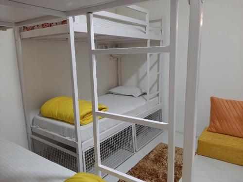 a bunk bed with two bunk beds in a room at Sprinklers in New Delhi