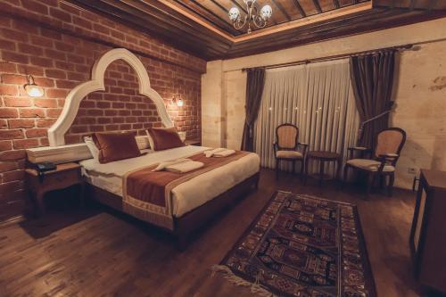 Ένα ή περισσότερα κρεβάτια σε δωμάτιο στο Sobek Stone House Cappadocia