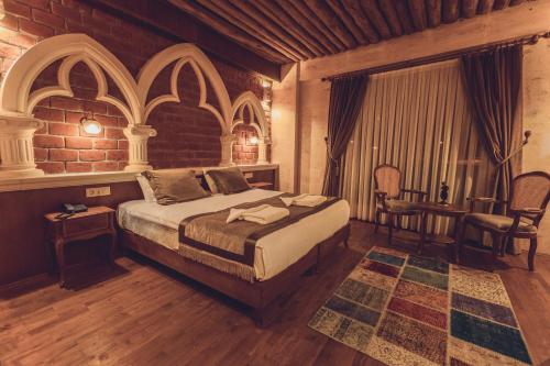 Ένα ή περισσότερα κρεβάτια σε δωμάτιο στο Sobek Stone House Cappadocia