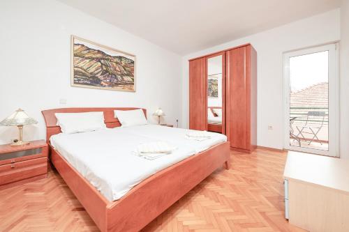 Postel nebo postele na pokoji v ubytování Vila Veljko