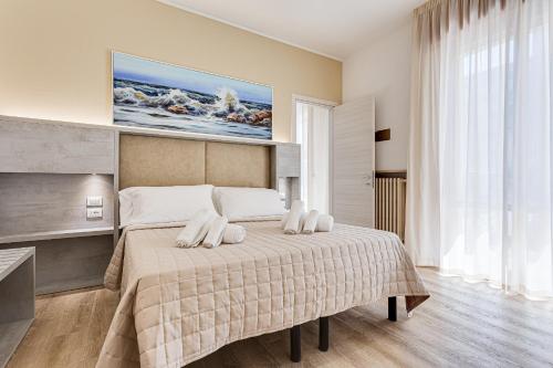 Ліжко або ліжка в номері Hotel Amalfi