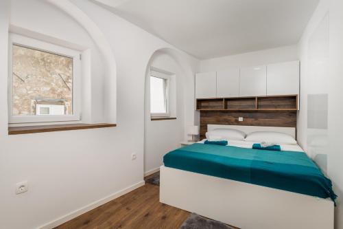 Postel nebo postele na pokoji v ubytování Central Apartments Dalmatina