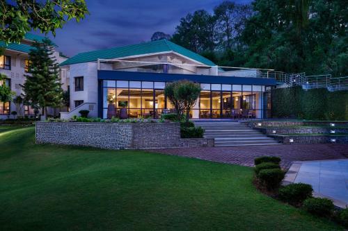 a large house with a building at Vivanta Katra Vaishno Devi in Katra
