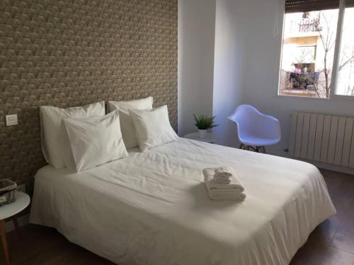 Łóżko lub łóżka w pokoju w obiekcie Retiro Park Apartments