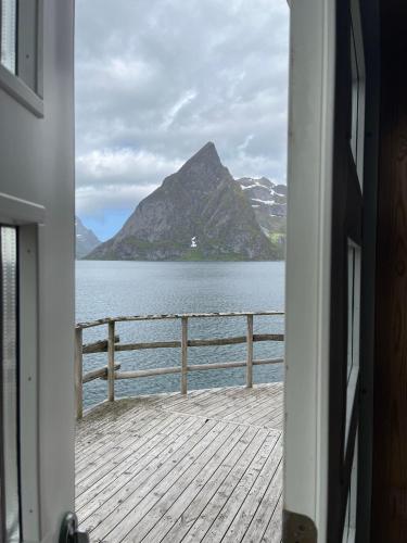 a view of a lake from a house doorway at Toppøy Rorbuer in Reine