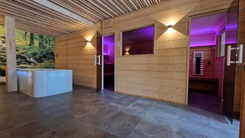 a large bathroom with a tub and a window at Schätzlhof OHG in Ruderting