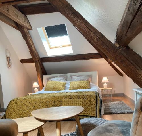 מיטה או מיטות בחדר ב-Clos de belle roche