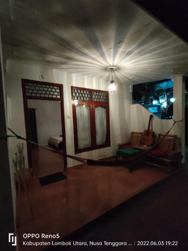 a view of a living room with a room with a room at H.Said Homestay in Gili Trawangan
