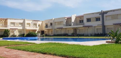 Πισίνα στο ή κοντά στο Bel appartement Savannah Beach