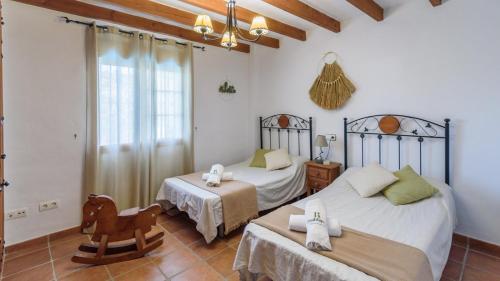 Postel nebo postele na pokoji v ubytování Casa Las Esparragueras Competa by Ruralidays