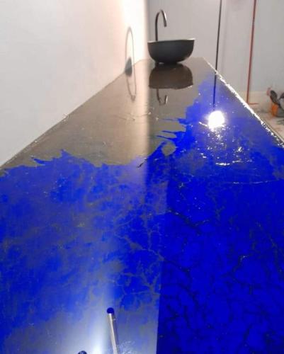 a table with blue paint and a sink on it at Dimora Bormioli in Bari