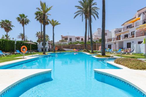The swimming pool at or close to marina real 221
