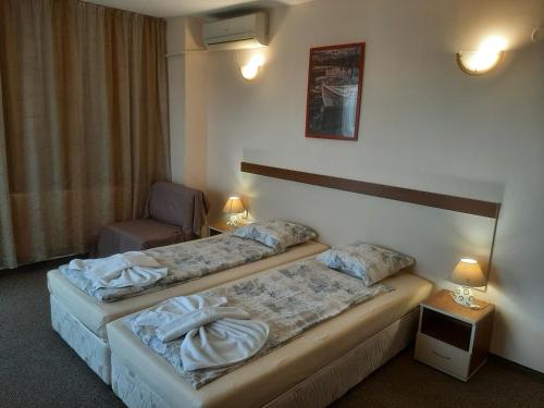 Postel nebo postele na pokoji v ubytování Hotel Orchidea