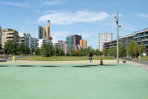 a person riding a skateboard in a park at aletto Hotel Potsdamer Platz in Berlin