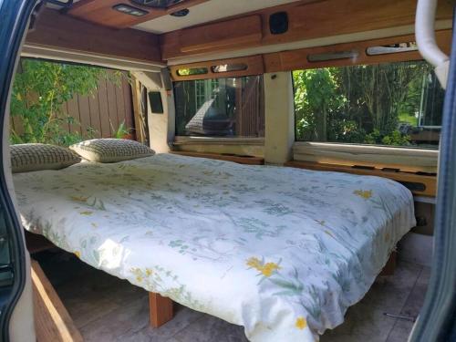 a bed in the back of a van at Maui CamperVan 2 Cozy Convenient and Classy in Kahului