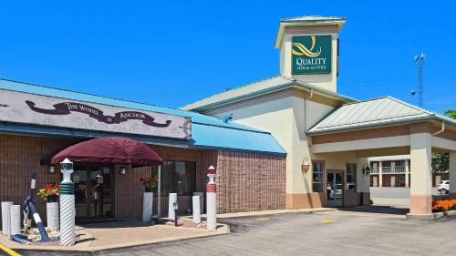 a store front of a building with a sign on it at Quality Inn & Suites 1000 Islands in Gananoque