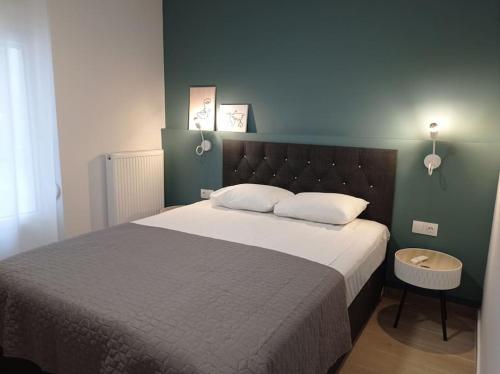 a bedroom with a large bed with white pillows at Partcon Studio in Private Property A in Neoi Epivates