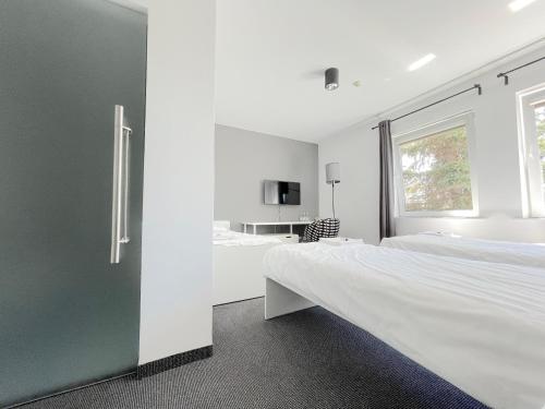 Posteľ alebo postele v izbe v ubytovaní Bell's Hotel