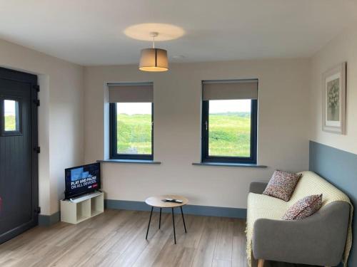 A television and/or entertainment centre at Natures Rest Apartment