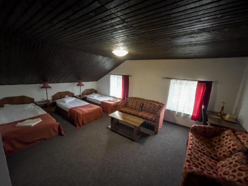 מיטה או מיטות בחדר ב-Pensiunea Dacia Deva