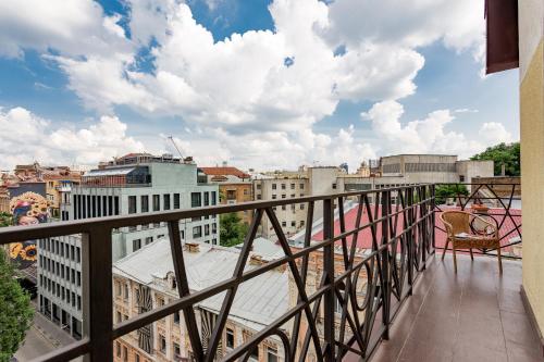 a balcony with a view of a city at Senator Maidan in Kyiv